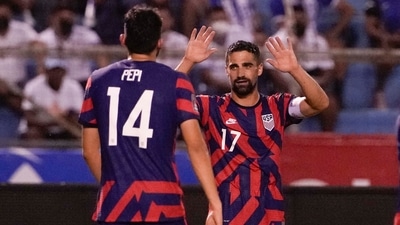 United States' Sebastian Lletget, right, celebrates with his teammate Ricardo Pepi after scoring his side's fourth goal against Honduras during a qualifying soccer match for the FIFA World Cup Qatar 2022, in San Pedro Sula, Honduras. (AP)
