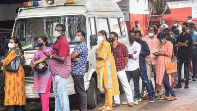 Beneficiaries wait in a queue to receive Covid-19 vaccine dose, at Eranamkulam General Hospital in Kochi. (PTI)