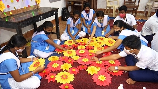 Students of Bipin Bihari Choudhury High School prepare the decorative works in the classroom on the eve of the Ganesh Chaturthi festival celebration, in Bhubaneswar.(ANI)