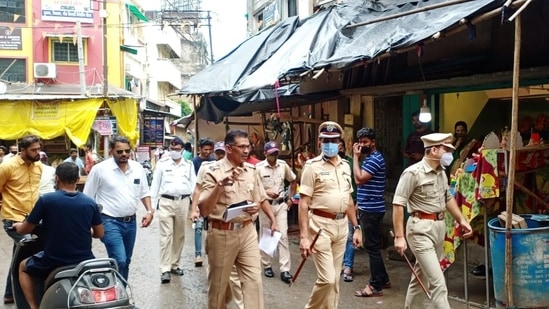 Police personnel inspect the Chitaroli market on the eve of the Ganesh Chaturthi festival, in Nagpur.(ANI)