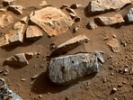 In image released by NASA and taken by NASA's Perseverance rover on September 7, 2021, two holes where the rover's drill obtained chalk-size samples from rock nicknamed 