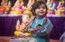 A child sits near idol of Ganesha with the musical instrument Manjira in hand on the eve of Ganesh Chaturthi, at Kasba Peth, in Pune. (Pratham Gokhale/Hindustan Times) A child sits near idol of Ganesha with the musical instrument Manjira in hand on the eve of Ganesh Chaturthi, at Kasba Peth, in Pune. (Pratham Gokhale/Hindustan Times)