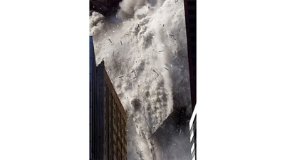 Smoke and debris fill the air after one of the World Trade Centre towers in New York City collapsed on September 11, 2001. Stapleton recalls that after the South Tower fell, he looked at the screen of his digital camera – the first he had owned – and, pleased with his pictures, decided to deliver them to his editor. Minutes later, after the two left the area, the North Tower collapsed. Stapleton thinks that if he had been using his usual film instead of having the immediate confirmation of good digital images, he might have stayed on the scene and been there when the tower fell – and become another victim. (Shannon Stapleton / REUTERS)