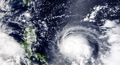 Satellite image released by NASA, Typhoon Chanthu, right, develops into a powerful typhoon moving towards Taiwan, top left. Chanthu continues gaining strength and is expected to make landfall in Taiwan over the weekend. ( AP) Satellite image released by NASA, Typhoon Chanthu, right, develops into a powerful typhoon moving towards Taiwan, top left. Chanthu continues gaining strength and is expected to make landfall in Taiwan over the weekend. ( AP)
