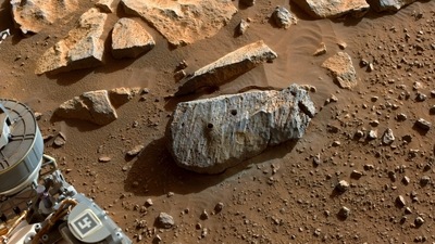 In image released by NASA and taken by NASA's Perseverance rover on September 7, 2021, two holes where the rover's drill obtained chalk-size samples from rock nicknamed "Rochette." (AFP) In image released by NASA and taken by NASA's Perseverance rover on September 7, 2021, two holes where the rover's drill obtained chalk-size samples from rock nicknamed "Rochette." (AFP)