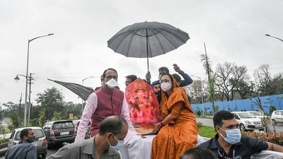 Madhya Pradesh Chief Minister Shivraj Singh Chouhan with wife Sadhna Singh, carries an idol of Lord Ganesha to install at his residence on the occasion of Ganesh Chaturthi, in Bhopal on September 10. (PTI) Madhya Pradesh Chief Minister Shivraj Singh Chouhan with wife Sadhna Singh, carries an idol of Lord Ganesha to install at his residence on the occasion of Ganesh Chaturthi, in Bhopal on September 10. (PTI)