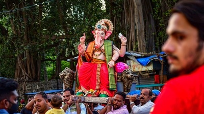 Devotees carry an idol of Lord Ganesha ahead of the Ganesh Chaturthi fetival, at Lalbaug in Mumbai. (PTI Photo) Devotees carry an idol of Lord Ganesha ahead of the Ganesh Chaturthi fetival, at Lalbaug in Mumbai. (PTI Photo)