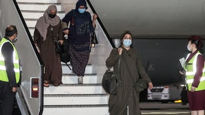 Evacuees from Afghanistan arrive at Hamad International Airport in Qatar's capital Doha on the first flight carrying foreigners out of the Afghan capital since the conclusion of the US withdrawal last month, September 9, 2021. (AFP) Evacuees from Afghanistan arrive at Hamad International Airport in Qatar's capital Doha on the first flight carrying foreigners out of the Afghan capital since the conclusion of the US withdrawal last month, September 9, 2021. (AFP)