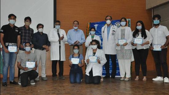 A felicitation ceremony underway at DMCH in Ludhiana on Friday. (HT photo)