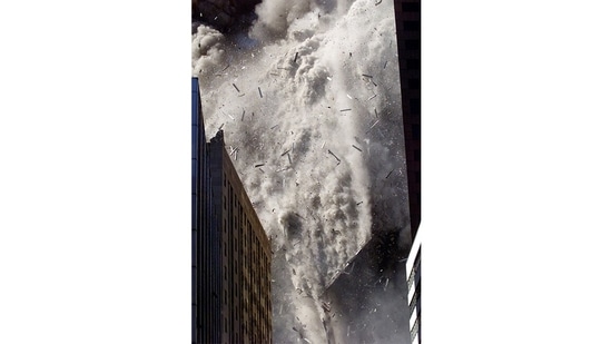 Smoke and debris fill the air after one of the World Trade Centre towers in New York City collapsed on September 11, 2001. Stapleton recalls that after the South Tower fell, he looked at the screen of his digital camera – the first he had owned – and, pleased with his pictures, decided to deliver them to his editor. Minutes later, after the two left the area, the North Tower collapsed. Stapleton thinks that if he had been using his usual film instead of having the immediate confirmation of good digital images, he might have stayed on the scene and been there when the tower fell – and become another victim.(Shannon Stapleton / REUTERS)