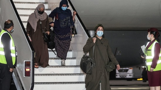 Evacuees from Afghanistan arrive at Hamad International Airport in Qatar's capital Doha on the first flight carrying foreigners out of the Afghan capital since the conclusion of the US withdrawal last month, September 9, 2021.(AFP)