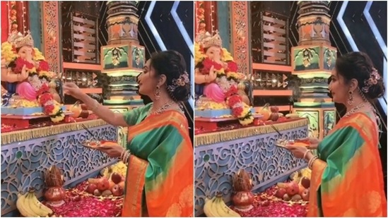 Madhuri Dixit Nene shared a video of herself offering prayers to Lord Ganesha in a gorgeous Banarasi saree and heavy jewellery.(Instagram/@madhuridixit)