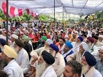 Haryana: Farmers during their sit-in protest demanding action against IAS officer Ayush Sinha over police lathi-charge on the protesting farmers in August in Karnal on Thursday.&nbsp;