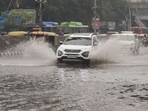 Traffic is seen in a waterlogged area following heavy rain in New Delhi, (PTI Photo) Traffic is seen in a waterlogged area following heavy rain in New Delhi, (PTI Photo)