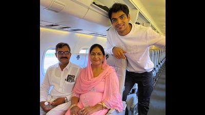 Olympic gold medallist Neeraj Chopra with his parents. (PTI)