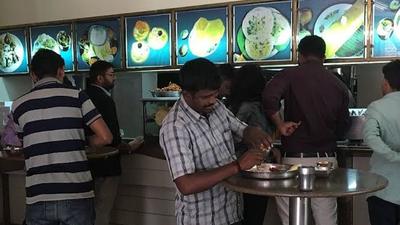 The big change that Prabhakar brought to restaurant culture in Bengaluru was removing chairs from the restaurants and replacing them with tall tables, where people can stand and eat. The big change that Prabhakar brought to restaurant culture in Bengaluru was removing chairs from the restaurants and replacing them with tall tables, where people can stand and eat.