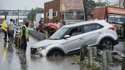 Traffic movement was affected at a few points of NH-48 between Dhaula Kuan and Gurugram, near Galleria Market, Khandsa, New Colony Road in Sector 7 and parts of Sector 52 due to the rainfall. (Parveen Kumar/HT Photo)