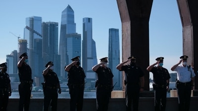 Military members honor a minute of silence during a ceremony to commemorate the 20th anniversary of the 9/11 attacks at the 9/11 memorial in Port Imperial Linear Park in Weehawken,New Jersey on September 11, 2021. (AFP) Military members honor a minute of silence during a ceremony to commemorate the 20th anniversary of the 9/11 attacks at the 9/11 memorial in Port Imperial Linear Park in Weehawken,New Jersey on September 11, 2021. (AFP)