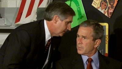 US President George W. Bush listens as White House Chief of Staff Andrew Card informs him of a second plane hitting the World Trade Center. (Reuters)