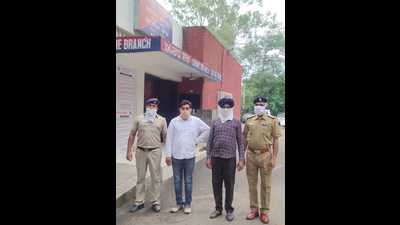 The accused in police custody on Saturday. They were posted in police’s salary branch when they embezzled the money. (HT Photo) The accused in police custody on Saturday. They were posted in police’s salary branch when they embezzled the money. (HT Photo)