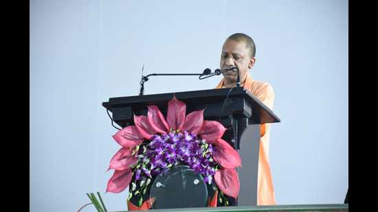 UP chief minister Yogi Adityanath speaking at the foundation stone-laying ceremony of the Uttar Pradesh National Law University, in Prayagraj, on Saturday. (HT Photo)