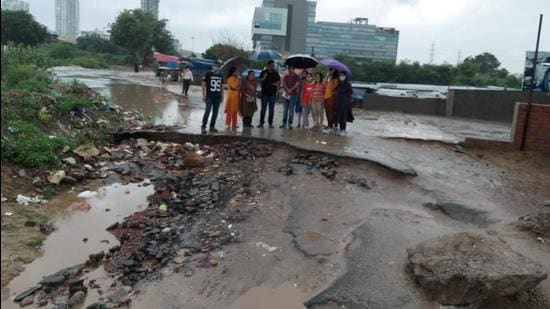 Residents of Emerald Hills condominium in Sector 65 on Saturday held a sit-in protest outside their society to protest against the lack of an access road and lack of corrective measures after a temporary access road caved in last month.
