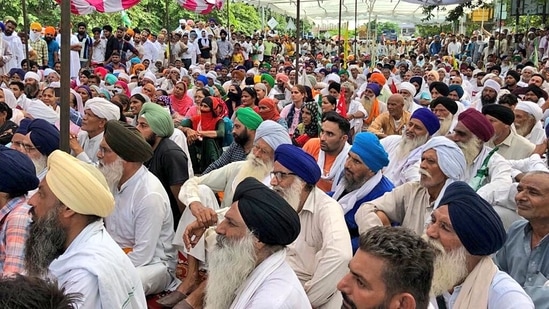 Haryana: Farmers during their sit-in protest demanding action against IAS officer Ayush Sinha over police lathi-charge on the protesting farmers in August in Karnal on Thursday.&nbsp;(ANI)