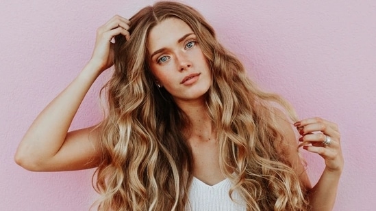 Oily scalp can lead to dandruff, itchiness or even hair fall. Here are expert tips for a healthy hair.(Unsplash)