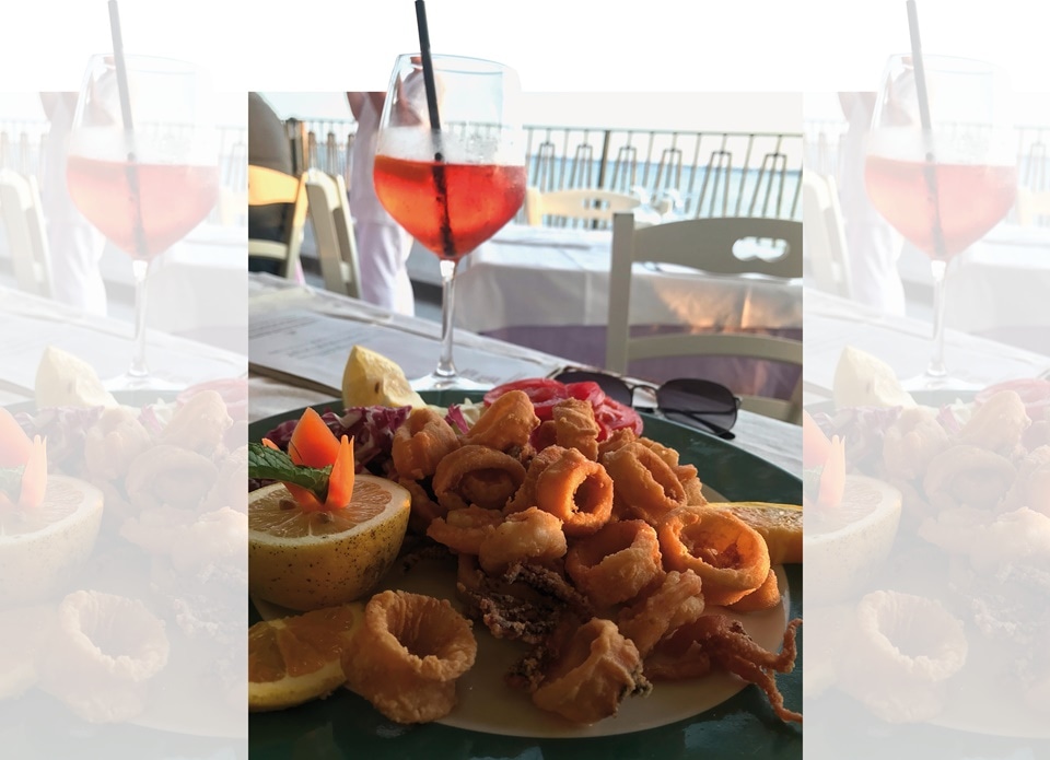 Aperitivo in Naples: Spritz cocktail with fried calamari(Photo by Natasha Celmi)