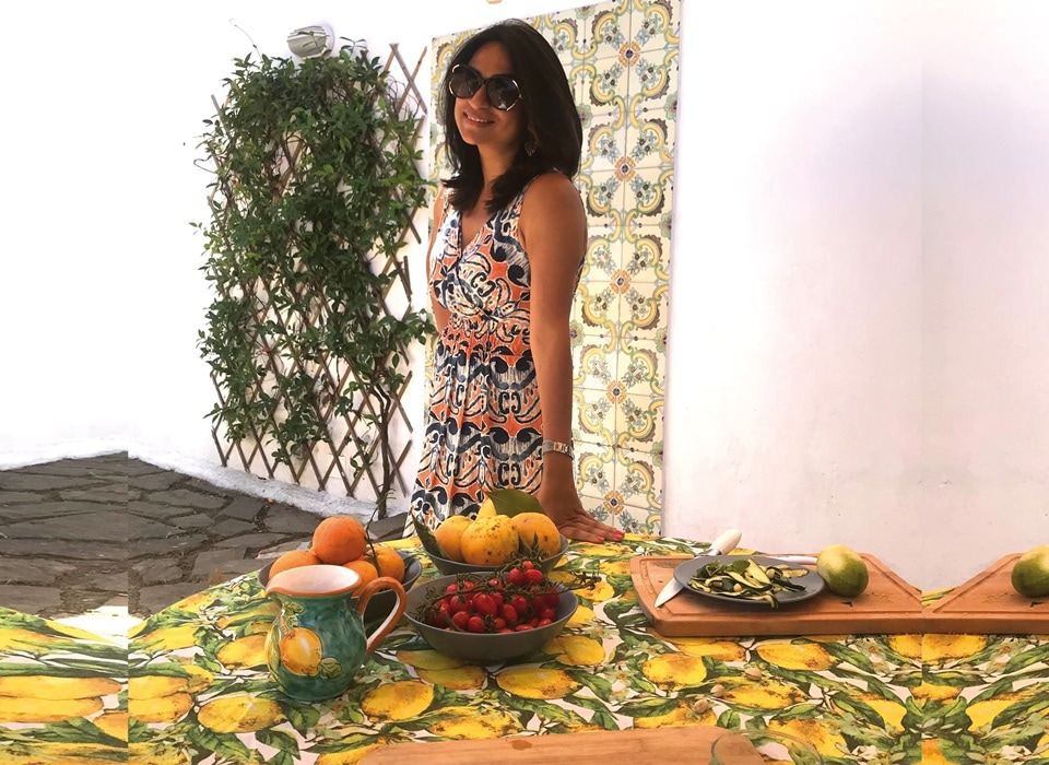 The author cooking with seasonal produce on their terrace