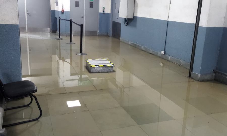Water is seen on the floor in one of the areas of Delhi airport (Twitter/@Ashoke_Raj) Water is seen on the floor in one of the areas of Delhi airport (Twitter/@Ashoke_Raj)