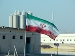Iranian flag in Iran's Bushehr nuclear power plant, during an official ceremony to kick-start works on a second reactor at the facility.(AFP) Iranian flag in Iran's Bushehr nuclear power plant, during an official ceremony to kick-start works on a second reactor at the facility.(AFP)