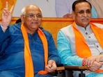 Newly elected Gujarat chief minister Bhupendra Patel shows victory sign in presence of his predecessor Vijay Rupani at the BJP headquarters in Gandhinagar on Sunday.(ANI) Newly elected Gujarat chief minister Bhupendra Patel shows victory sign in presence of his predecessor Vijay Rupani at the BJP headquarters in Gandhinagar on Sunday.(ANI)