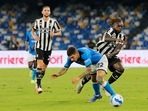 Juventus' Italian forward Moise Kean (R) fights for the ball with Napoli's Italian defender Giovanni Di Lorenzo (C) during the Serie A football match Juventus' Italian forward Moise Kean (R) fights for the ball with Napoli's Italian defender Giovanni Di Lorenzo (C) during the Serie A football match