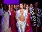 Models, including Gigi Hadid, centre, walk the runway during the finale at the Brandon Maxwell spring/summer 2022 fashion show.(Evan Agostini/Invision/AP) Models, including Gigi Hadid, centre, walk the runway during the finale at the Brandon Maxwell spring/summer 2022 fashion show.(Evan Agostini/Invision/AP)