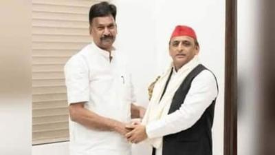 BJP lawmaker Rakesh Rathore with Samajwadi Party president Akhilesh Yadav. (SOURCED IMAGE) BJP lawmaker Rakesh Rathore with Samajwadi Party president Akhilesh Yadav. (SOURCED IMAGE)