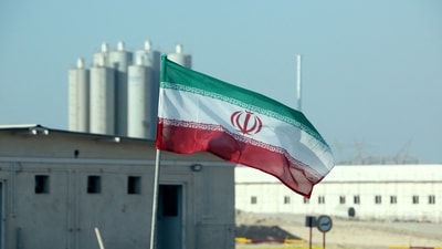 Iranian flag in Iran's Bushehr nuclear power plant, during an official ceremony to kick-start works on a second reactor at the facility. (AFP) Iranian flag in Iran's Bushehr nuclear power plant, during an official ceremony to kick-start works on a second reactor at the facility. (AFP)