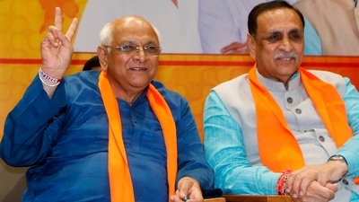 Newly elected Gujarat chief minister Bhupendra Patel shows victory sign in presence of his predecessor Vijay Rupani at the BJP headquarters in Gandhinagar on Sunday. (ANI) Newly elected Gujarat chief minister Bhupendra Patel shows victory sign in presence of his predecessor Vijay Rupani at the BJP headquarters in Gandhinagar on Sunday. (ANI)