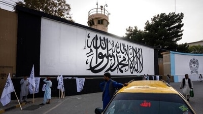 The iconic Taliban flag is painted on a wall outside the American embassy compound in Kabul on 9/11. (AP Photo) The iconic Taliban flag is painted on a wall outside the American embassy compound in Kabul on 9/11. (AP Photo)