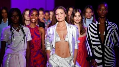 Models, including Gigi Hadid, centre, walk the runway during the finale at the Brandon Maxwell spring/summer 2022 fashion show. (Evan Agostini/Invision/AP) Models, including Gigi Hadid, centre, walk the runway during the finale at the Brandon Maxwell spring/summer 2022 fashion show. (Evan Agostini/Invision/AP)