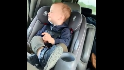 The image taken from the video shows a kid enjoying a car ride. (Screengrab)