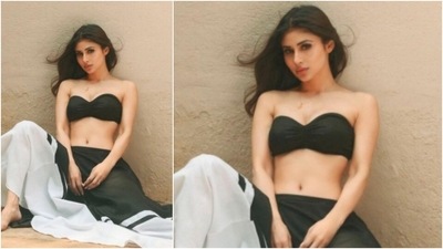 The ever so stylish Mouni Roy poses for the camera in a black tube top which she paired with a black and white skirt. (Instagram/@imouniroy)