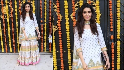 Karishma Tanna looked stunning in a printed sharara. She teamed her look with heavy earrings, bindi, ring, watch and a purse. (HT Photo/Varinder Chawla)