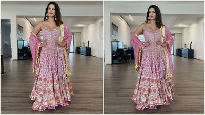 Sunny shared several photos of herself posing with her family, sitting near the elaborately decorated altar where Lord Ganesh's idol had been kept, and showing off her pretty pink suit. (Instagram/@sunnyleone)