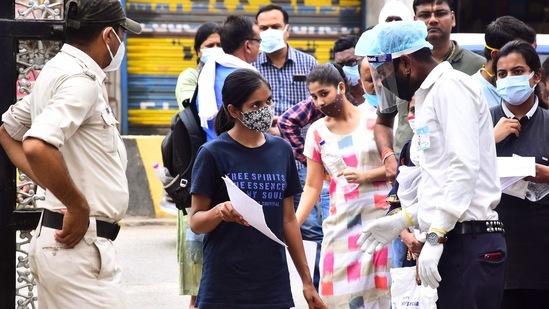 Students getting their documents checked outside an exam centre as they arrive to appear for the NEET exam 2021, in Jabalpur on September 12. (ANI)