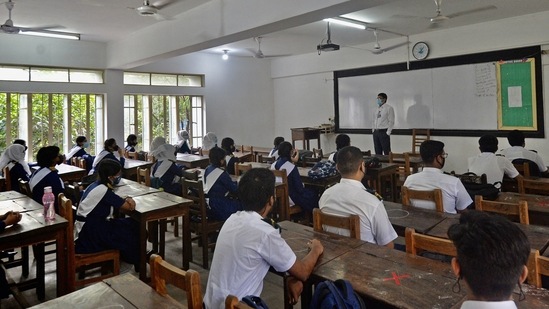 All educational institutions remained closed since March 2020 due to the surge in the number of coronavirus cases in the country. In this photo, students os Rajuk Uttara Model College, Dhaka can be seen attending an offline class. (AFP)