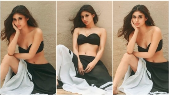 1. The ever so stylish Mouni Roy poses for the camera in a black tube top which she paired with a black and yellow skirt.(Instagram/@imouniroy)
