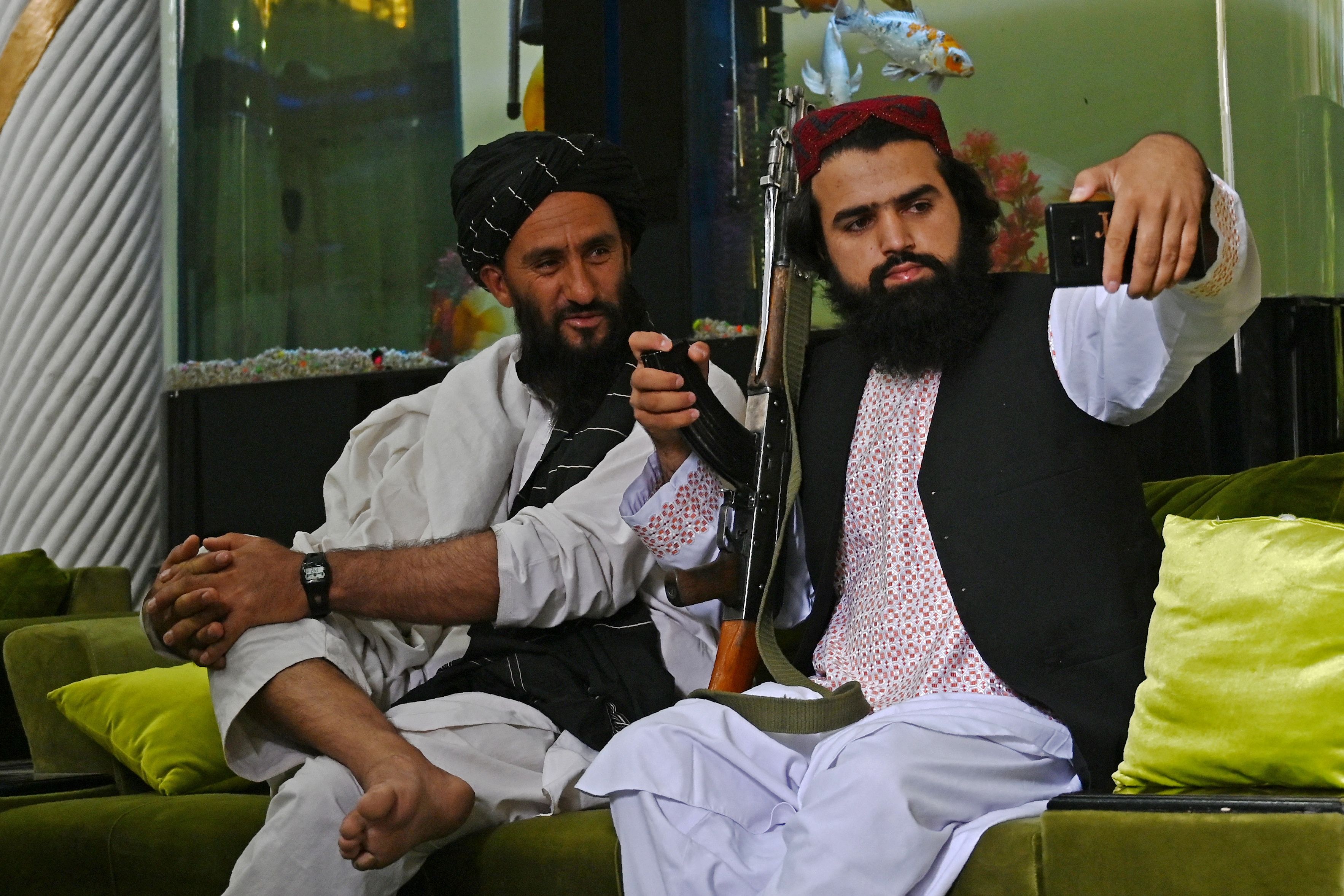 Taliban fighters take a selfie in Kabul's Dostum mansion (AFP) Taliban fighters take a selfie in Kabul's Dostum mansion (AFP)