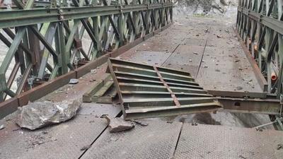 A bridge on National Highway number 5 was damaged at Urni in Kinnaur district of Himachal Pradesh due to shooting stones and a landslide triggered by rain on Monday. (HT Photo) A bridge on National Highway number 5 was damaged at Urni in Kinnaur district of Himachal Pradesh due to shooting stones and a landslide triggered by rain on Monday. (HT Photo)