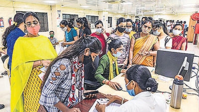 People register to receive Covid-19 vaccine dose, at Moti Lal Nehru Medical College, in Prayagraj on Monday. (PTI) People register to receive Covid-19 vaccine dose, at Moti Lal Nehru Medical College, in Prayagraj on Monday. (PTI)